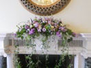Mantelpiece arrangement with veronica, scented stock, roses - ocean song, amnesia and avalanche