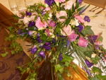 Top table flower arrangement in pinks and purples